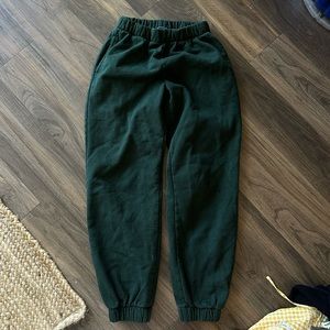 Brandy melville forest green sweats “john Galt”